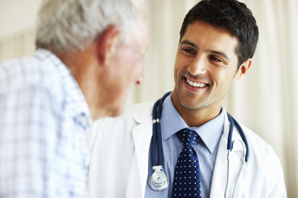 Inflection 360 physician speaking with an older patient during a healthcare consultation.